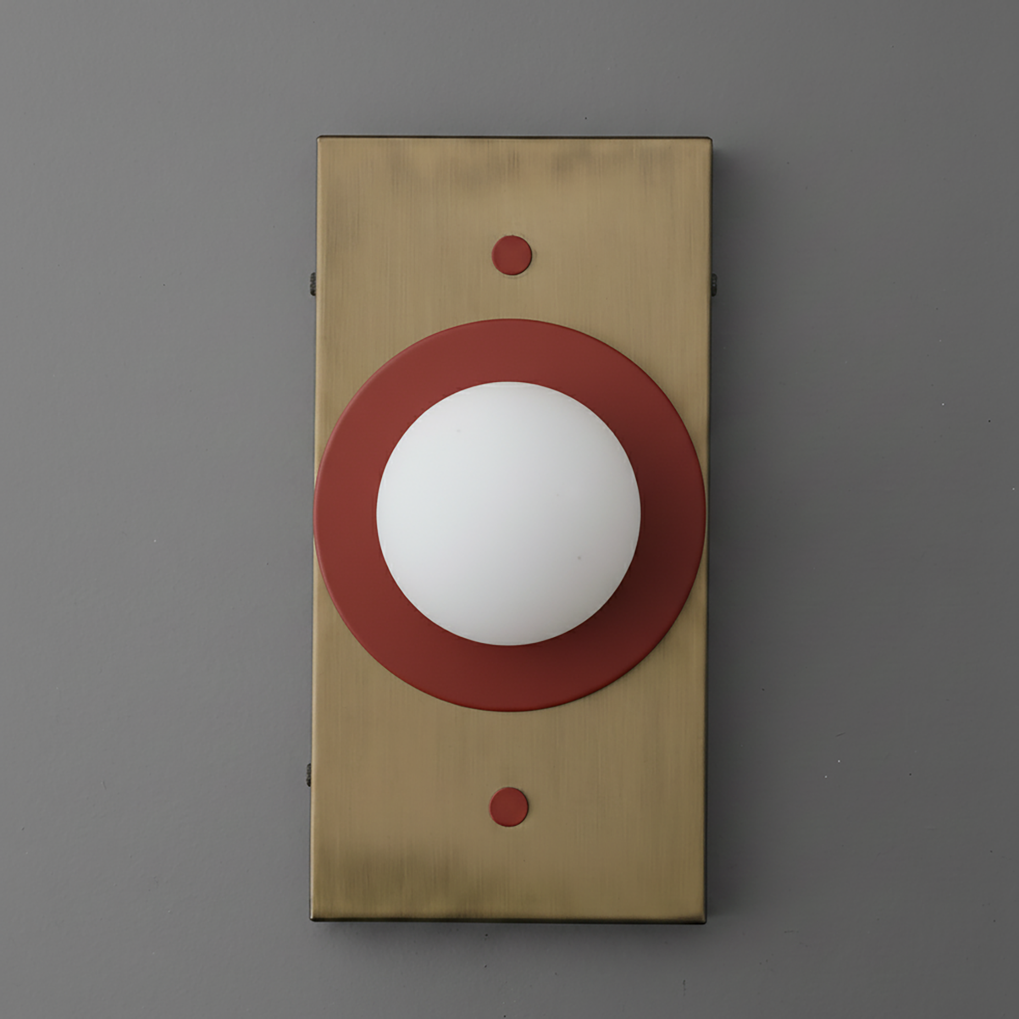 Antique brass rectangular sconce with a round white globe and brick red circular accent ring. - SCONCE MODEL NO. 4474