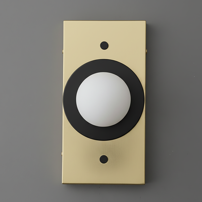 Antique brass rectangular sconce with black circular detail and white globe light on gray background. - SCONCE MODEL NO. 4474