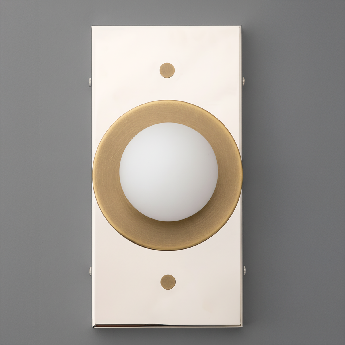 Wall sconce with rectangular cream backplate and antique brass circular mount holding a white globe shade. - SCONCE MODEL NO. 4474