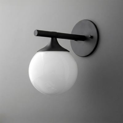 Black metal wall sconce with matte finish and large white frosted glass globe shade. - SCONCE MODEL NO. 1098