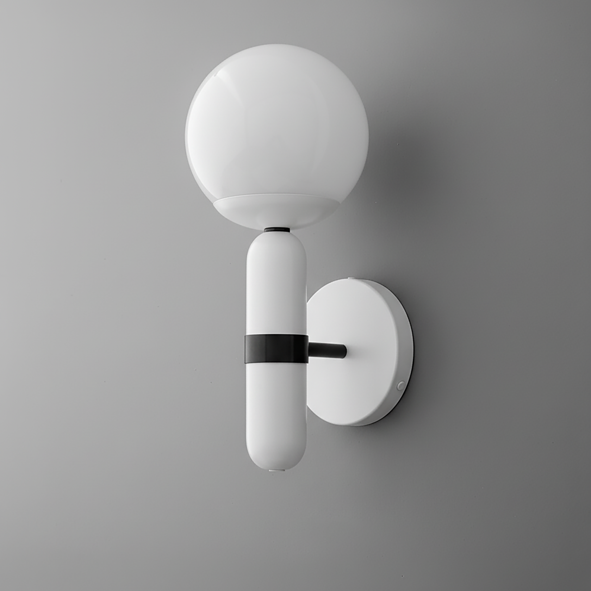 Modern white sconce with a round frosted glass globe and black metal accent on a white circular wall mount. - SCONCE MODEL NO. 4786