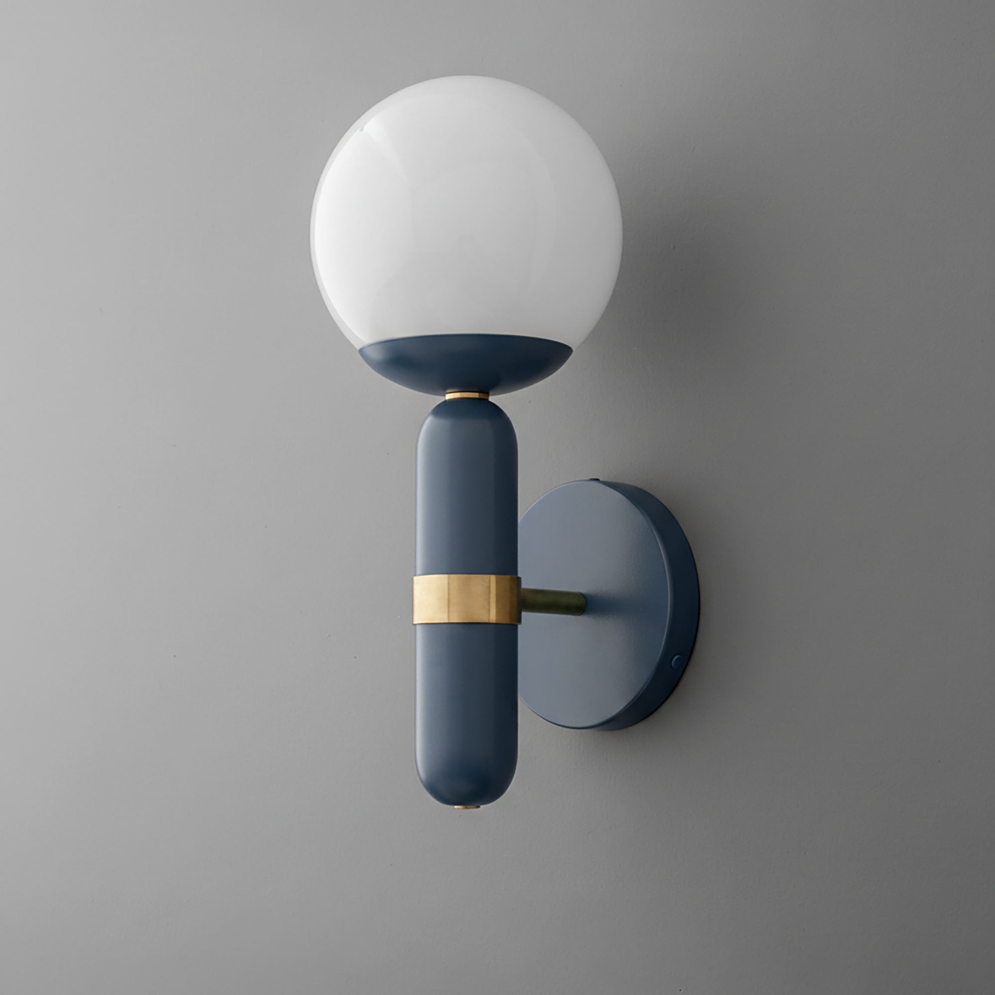 Modern wall sconce with matte blue cylindrical base, round white glass globe, and brass accent detail. - SCONCE MODEL NO. 4786