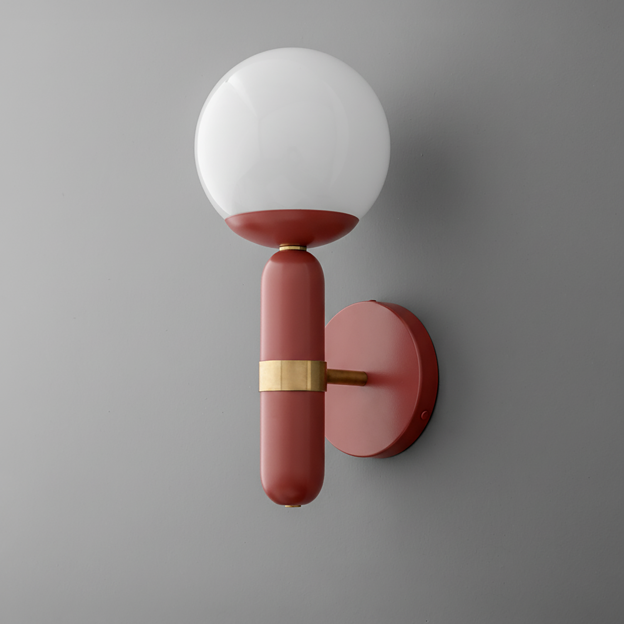 Wall sconce with matte brick red metal base and frosted white glass globe shade. - SCONCE MODEL NO. 4786
