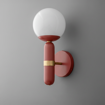 Wall sconce with matte brick red metal base and frosted white glass globe shade. - SCONCE MODEL NO. 4786