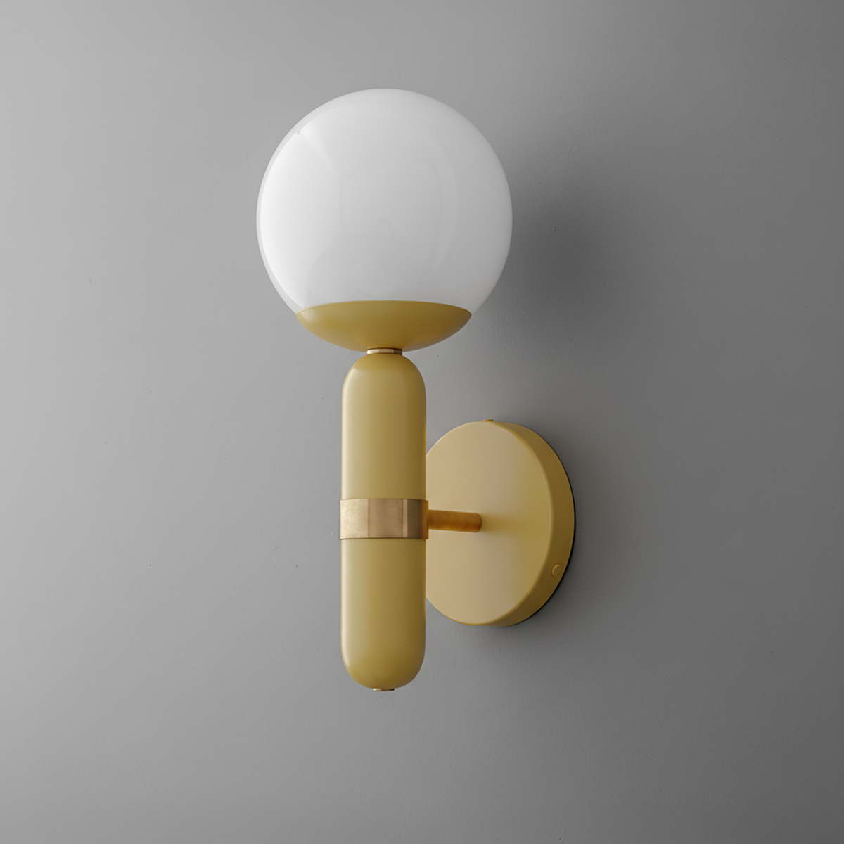 Wall sconce with raw brass base and matte yellow cylindrical stem topped by a frosted white glass globe shade. - SCONCE MODEL NO. 4786