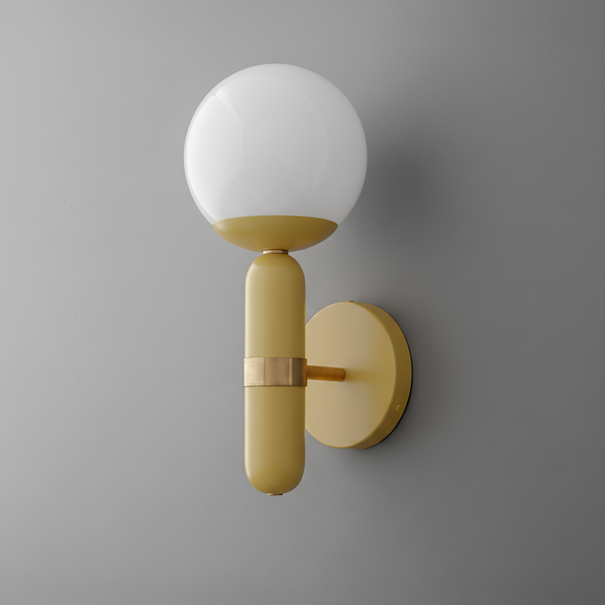 Wall sconce with raw brass base and matte yellow cylindrical stem topped by a frosted white glass globe shade. - SCONCE MODEL NO. 4786