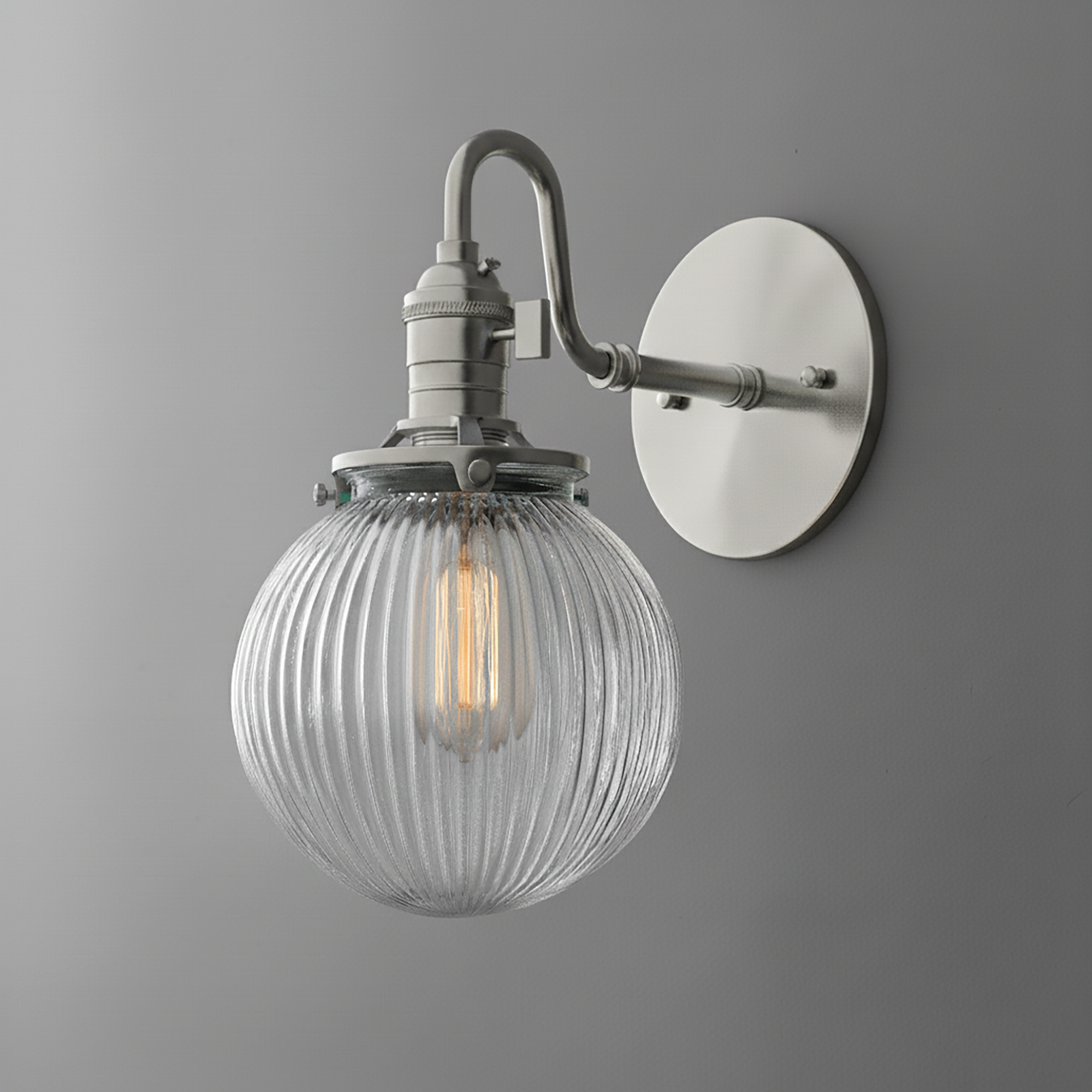 Wall-mounted sconce with ribbed clear glass globe and brushed nickel finish. - SCONCE MODEL NO. 3331