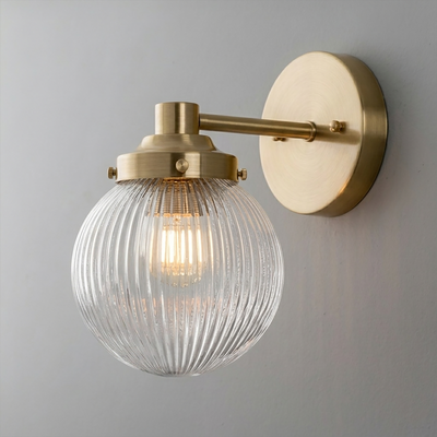 Wall sconce with ribbed clear glass globe and brushed brass metal fixture, single bulb design. - SCONCE MODEL NO. 7273