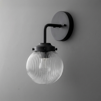 Black metal wall sconce with ribbed clear glass globe shade and single bulb design. - SCONCE MODEL NO. 6857