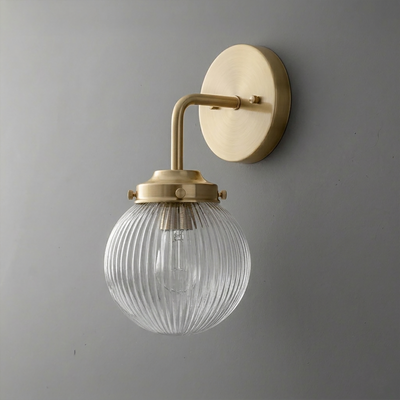 Wall sconce with brushed brass finish and ribbed clear glass globe shade. - SCONCE MODEL NO. 6857