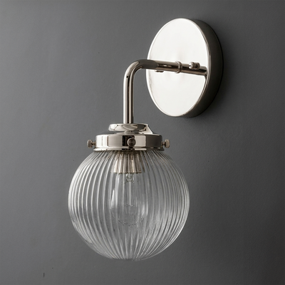 Wall-mounted sconce with polished nickel finish and ribbed clear glass globe shade. - SCONCE MODEL NO. 6857