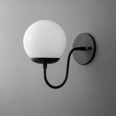 Black metal wall sconce with curved arm and round white glass globe shade. - SCONCE MODEL NO. 3849