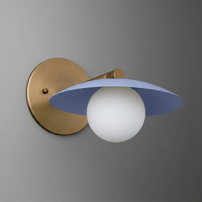 Wall sconce with round brass mounting and arm, featuring a matte blue flat disc shade and white globe bulb. - SCONCE MODEL NO. 9872