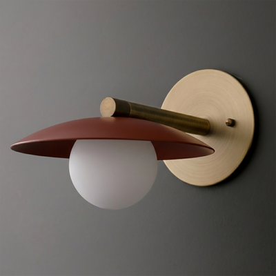 Wall-mounted sconce with brushed brass circular base, horizontal brass arm, and matte terracotta metal shade over frosted. - SCONCE MODEL NO. 9872