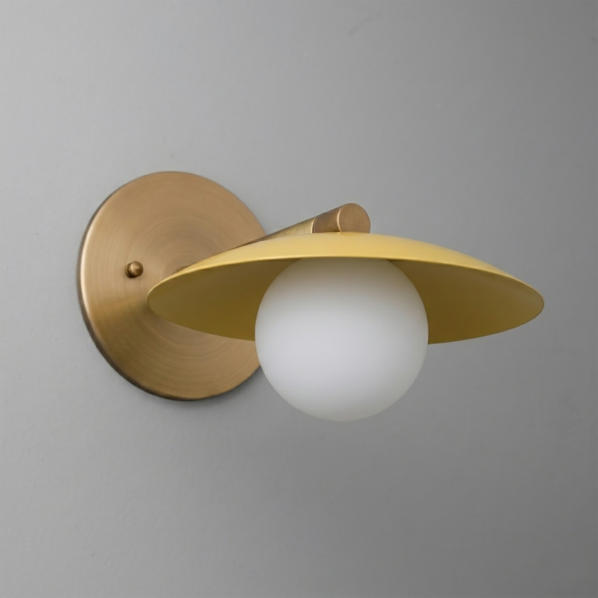 Brushed brass wall sconce with matte yellow conical shade and frosted white globe bulb. - SCONCE MODEL NO. 9872