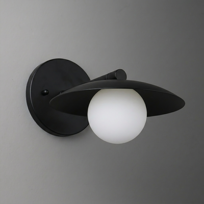 Black metal wall sconce with a wide disk-shaped shade and a white frosted glass globe bulb. - SCONCE MODEL NO. 9872