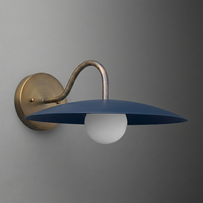 Wall-mounted sconce with curved brass arm and flat, wide matte blue metal shade over a white globe bulb. - SCONCE MODEL NO. 2162