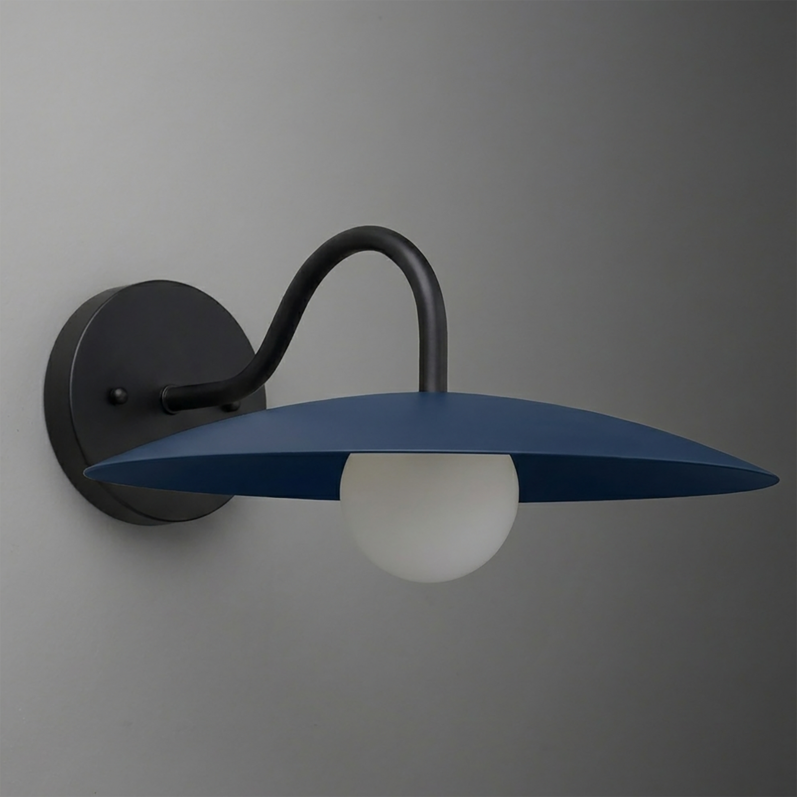Black metal wall sconce with curved arm and flat blue conical shade over frosted white globe bulb. - SCONCE MODEL NO. 2162