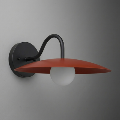 Wall sconce with matte black curved arm and round red-orange flat metal shade over frosted white bulb. - SCONCE MODEL NO. 2162