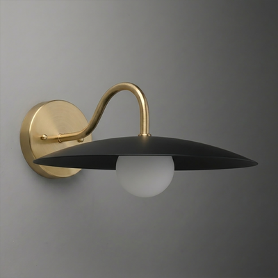 Matte black disc shade wall sconce with a round frosted bulb and curved brass arm mounting on brass wall plate. - SCONCE MODEL NO. 2162