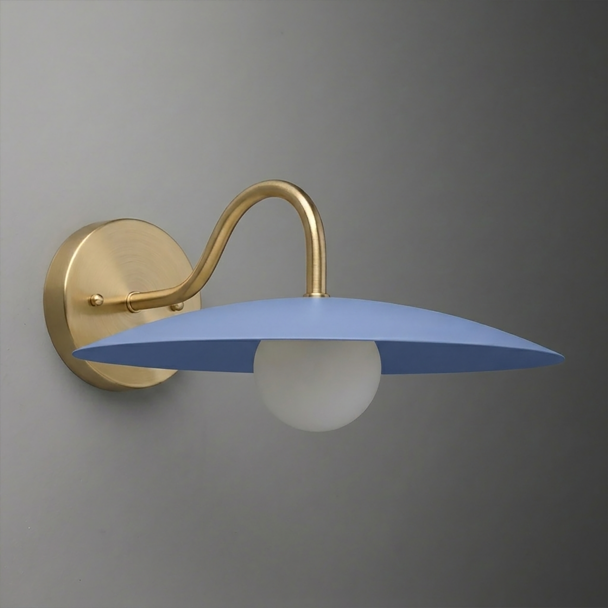 Wall sconce with brushed brass curved arm and round blue metal shade over frosted white bulb. - SCONCE MODEL NO. 2162