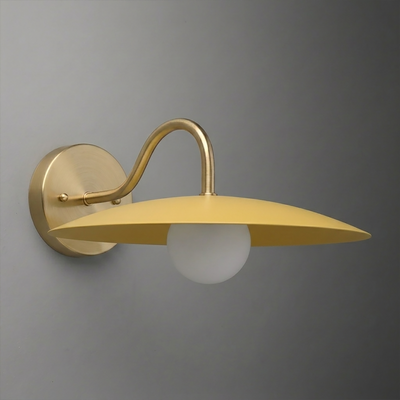 Matte gold metal wall sconce with curved arm and flat circular shade over round white bulb. - SCONCE MODEL NO. 2162