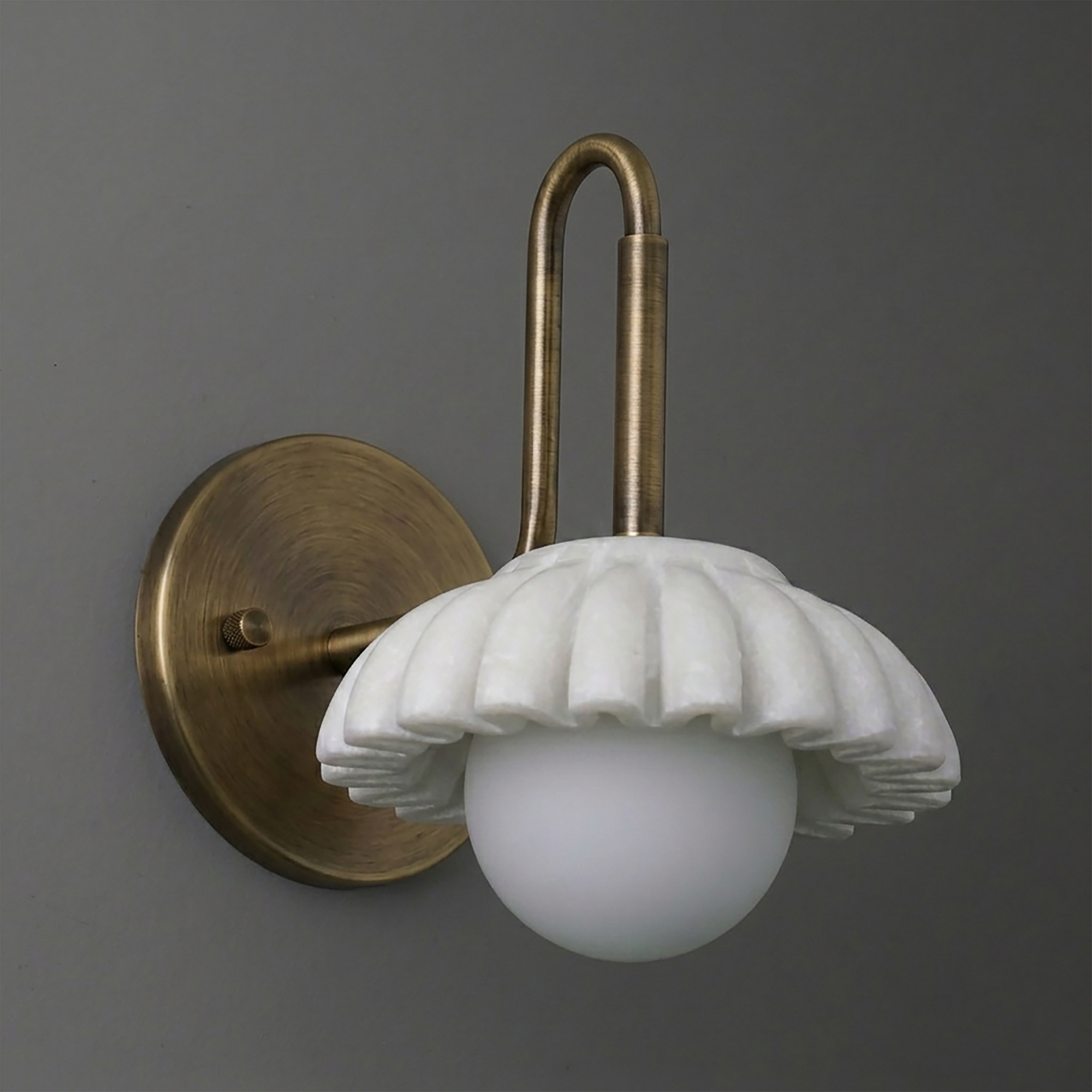 Antique brass wall sconce with fluted white ceramic shade and round frosted glass bulb cover. - SCONCE MODEL NO. 8633