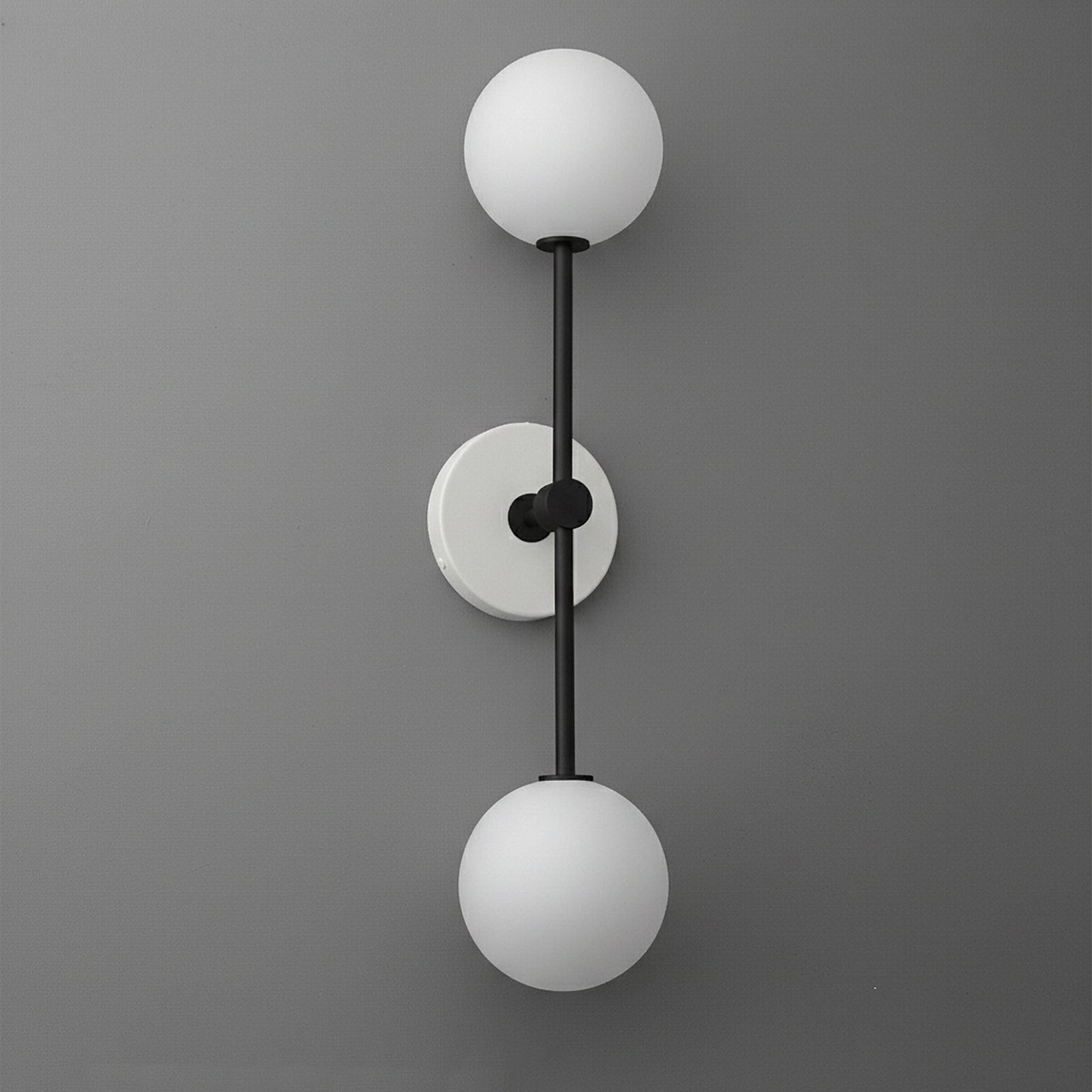 Modern black metal sconce with two frosted white glass globes and round wall mount. - SCONCE MODEL NO. 9776