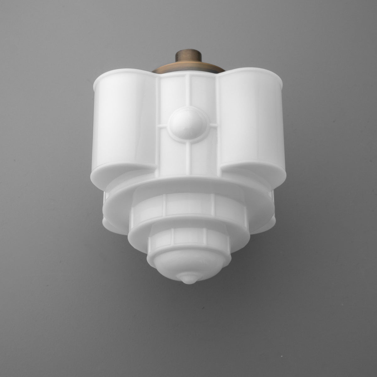 White tiered glass sconce with stepped geometric design and bronze mounting plate. - SCONCE MODEL NO. 1064