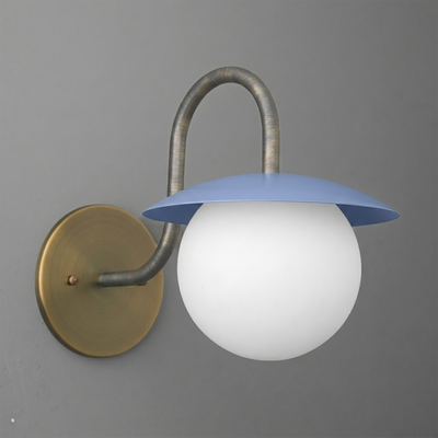 Wall sconce with a round brass base, curved metal arm, and blue metal shade over a white glass globe bulb. - SCONCE MODEL NO. 2206