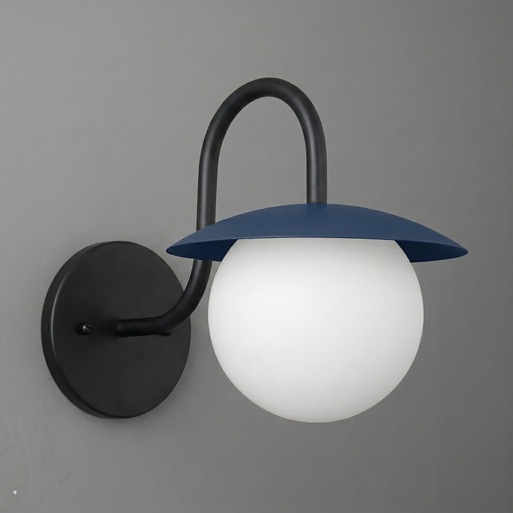 Black metal wall sconce with curved arm and blue dome-shaped shade over frosted white globe bulb. - SCONCE MODEL NO. 2206