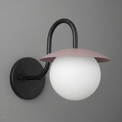 Wall sconce with black curved arm, round black base, and frosted white globe shade topped by pink metal cap. - SCONCE MODEL NO. 2206