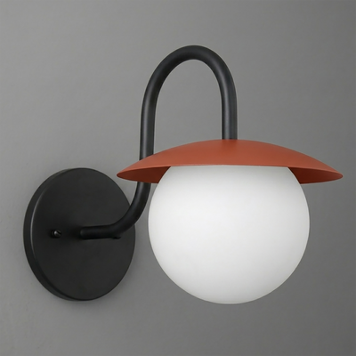 Wall sconce with matte black metal base and curved arm, featuring a frosted white glass globe and rust-colored flat metal. - SCONCE MODEL NO. 2206