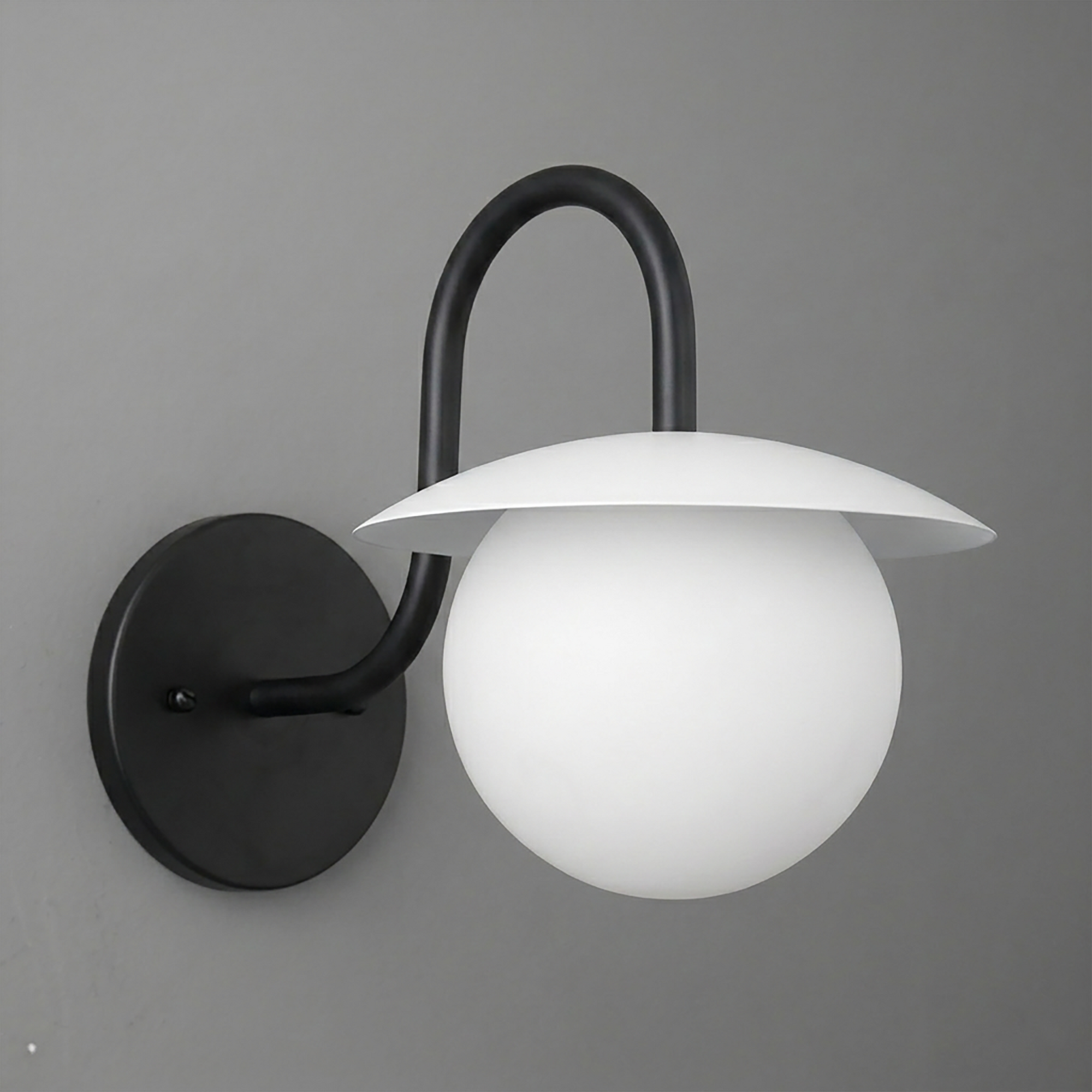 Matte black metal wall sconce with curved arm and white frosted glass globe shade. - SCONCE MODEL NO. 2206