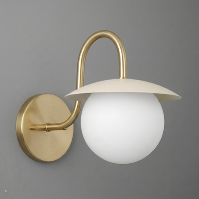 Wall sconce with brushed gold metal base and arm, featuring a white frosted glass globe and a flat, round cream-colored. - SCONCE MODEL NO. 2206