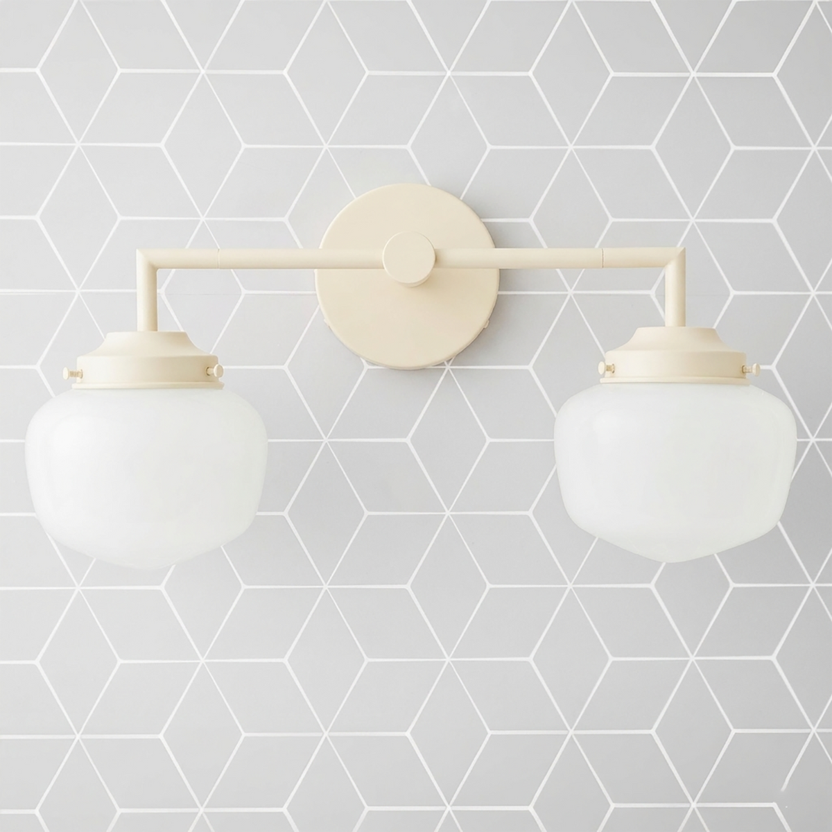 Matte cream-colored metal vanity light with two round white glass globes on straight horizontal bar. - VANITY LIGHT MODEL NO. 0276