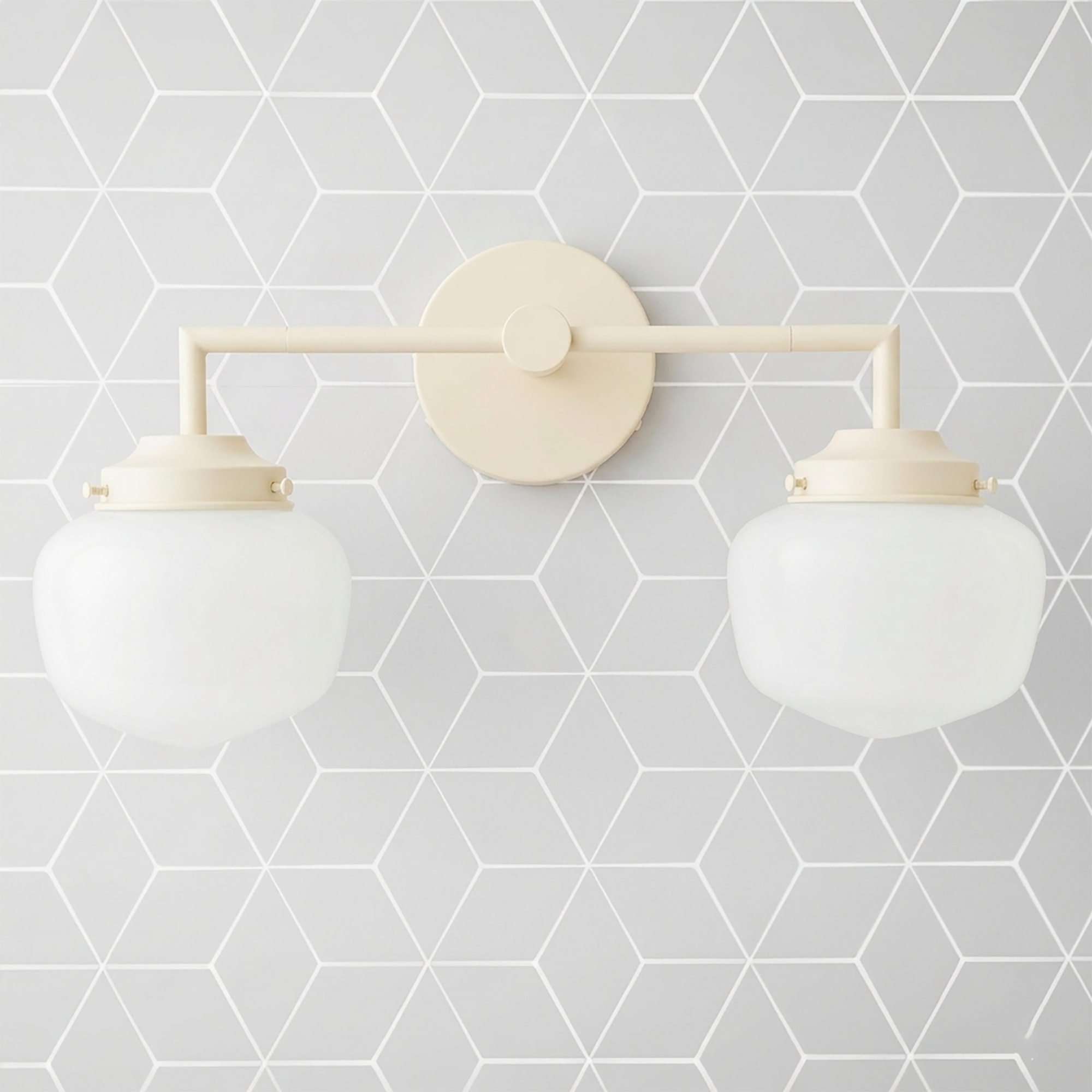 Matte cream-colored metal vanity light with two round white glass globes on straight horizontal bar. - VANITY LIGHT MODEL NO. 0276