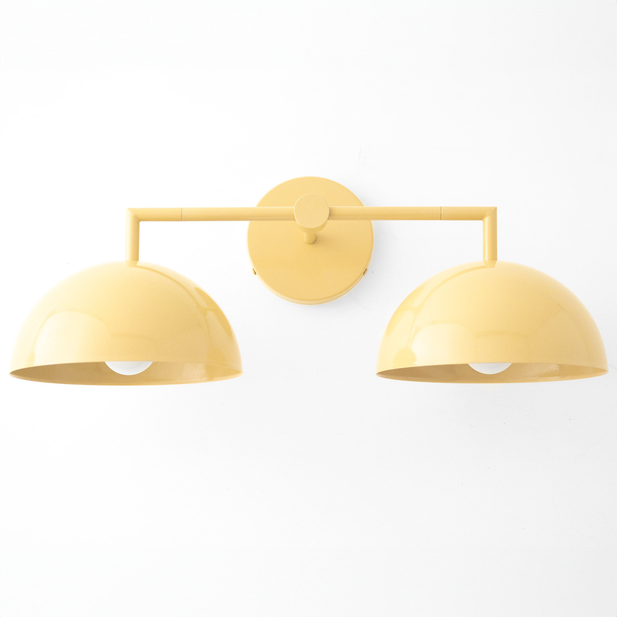 Yellow dome-shaped double vanity light with smooth matte finish and central round wall mount. - VANITY LIGHT MODEL NO. 6074