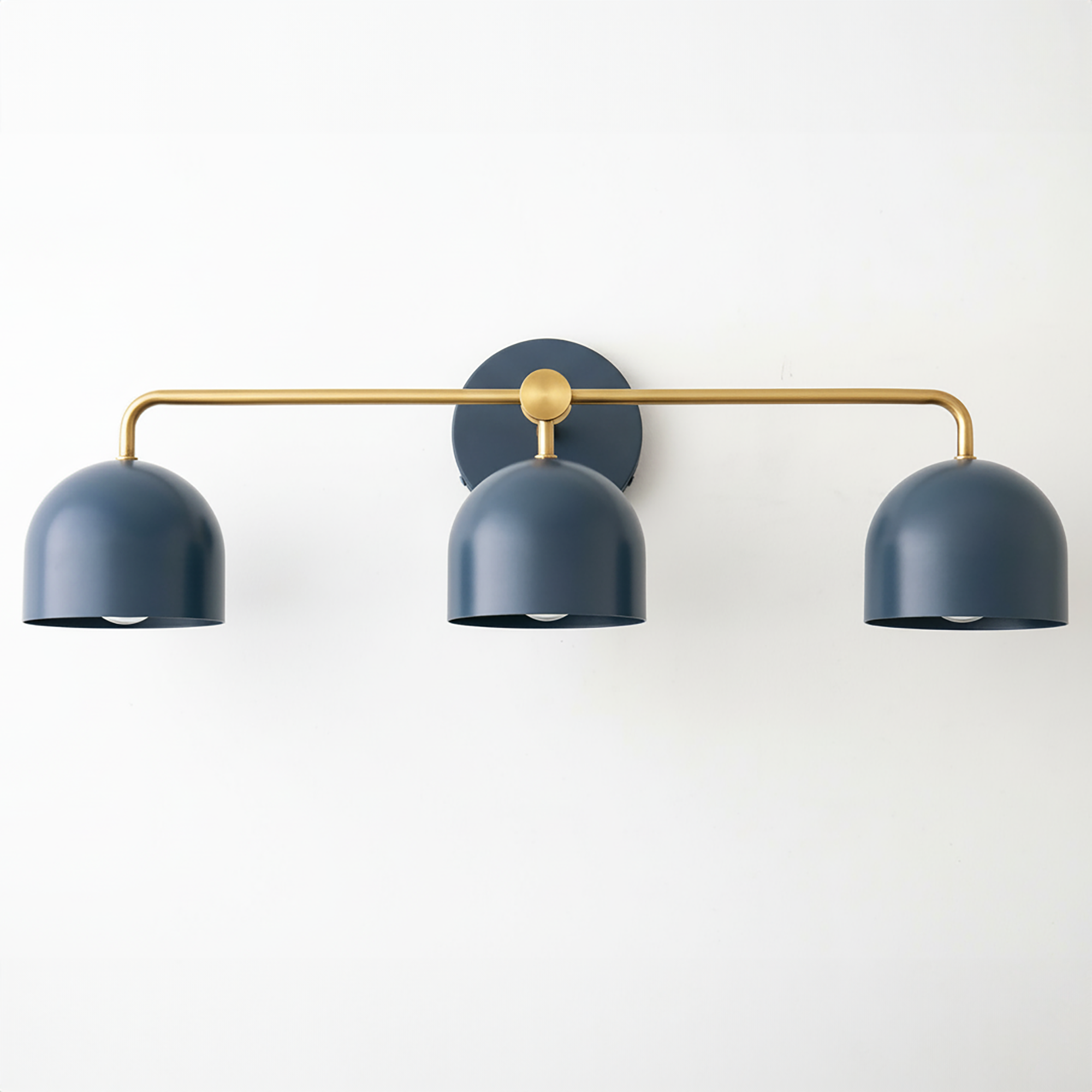 Mid-century modern vanity light with three matte coal blue dome shades and a brass horizontal bar mounting. - VANITY LIGHT MODEL NO. 7456
