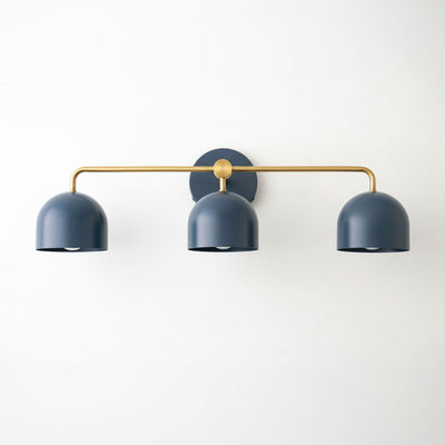 Mid-century modern vanity light with three deep blue metal dome shades and brass horizontal bar mount. - VANITY LIGHT MODEL NO. 7456