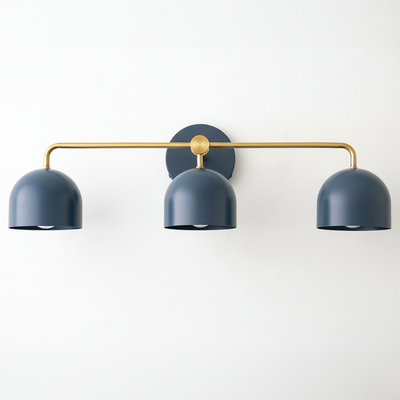 Mid-century modern vanity light with three matte coal blue dome shades and a brass horizontal bar mounting. - VANITY LIGHT MODEL NO. 7456