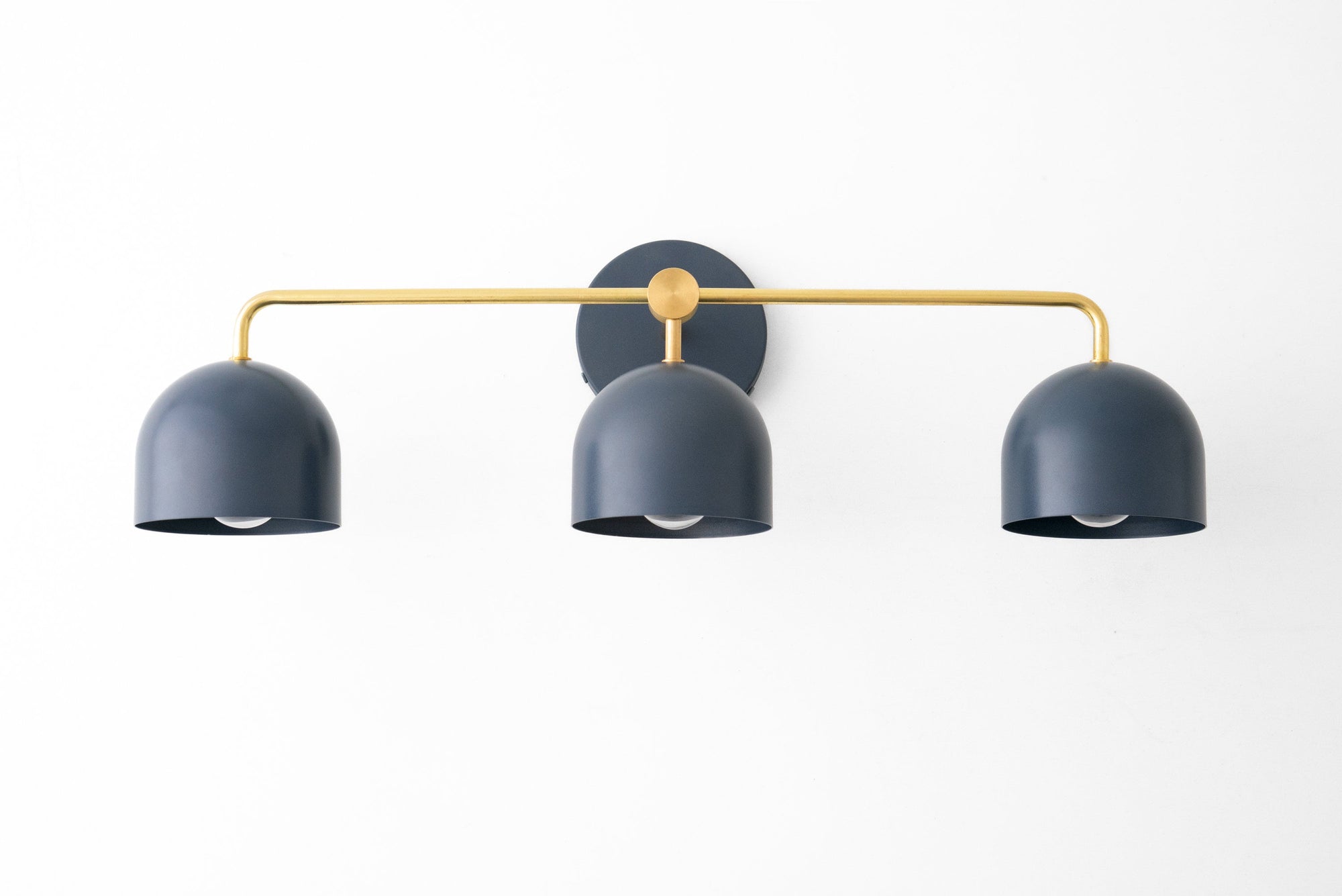 Deep blue three-bulb vanity light with curved shades and a slim gold horizontal bar mounting on a round black base. - VANITY LIGHT MODEL NO. 7456