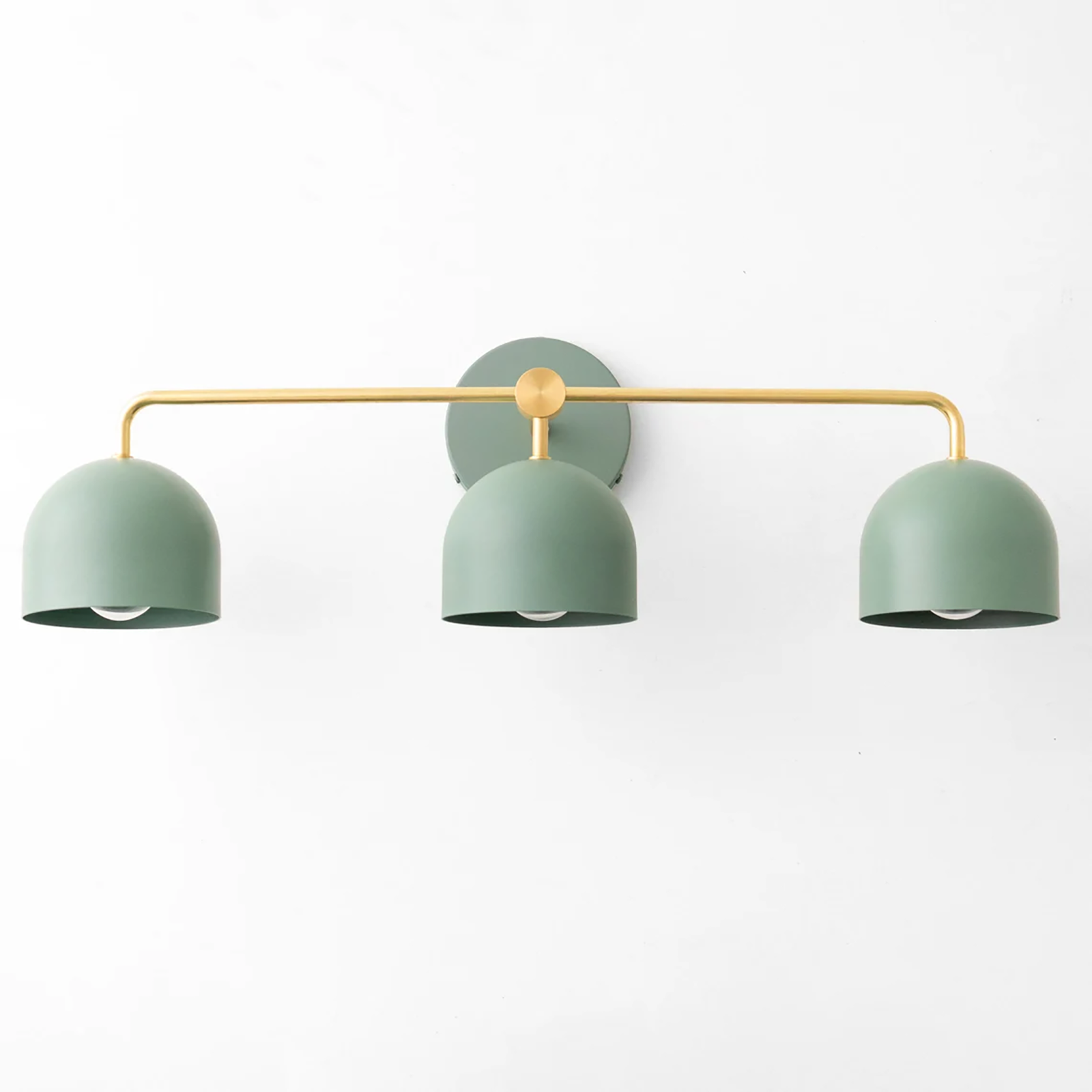 Mid-century modern vanity light with three matte green metal shades and a curved brass bar mount. - VANITY LIGHT MODEL NO. 7456