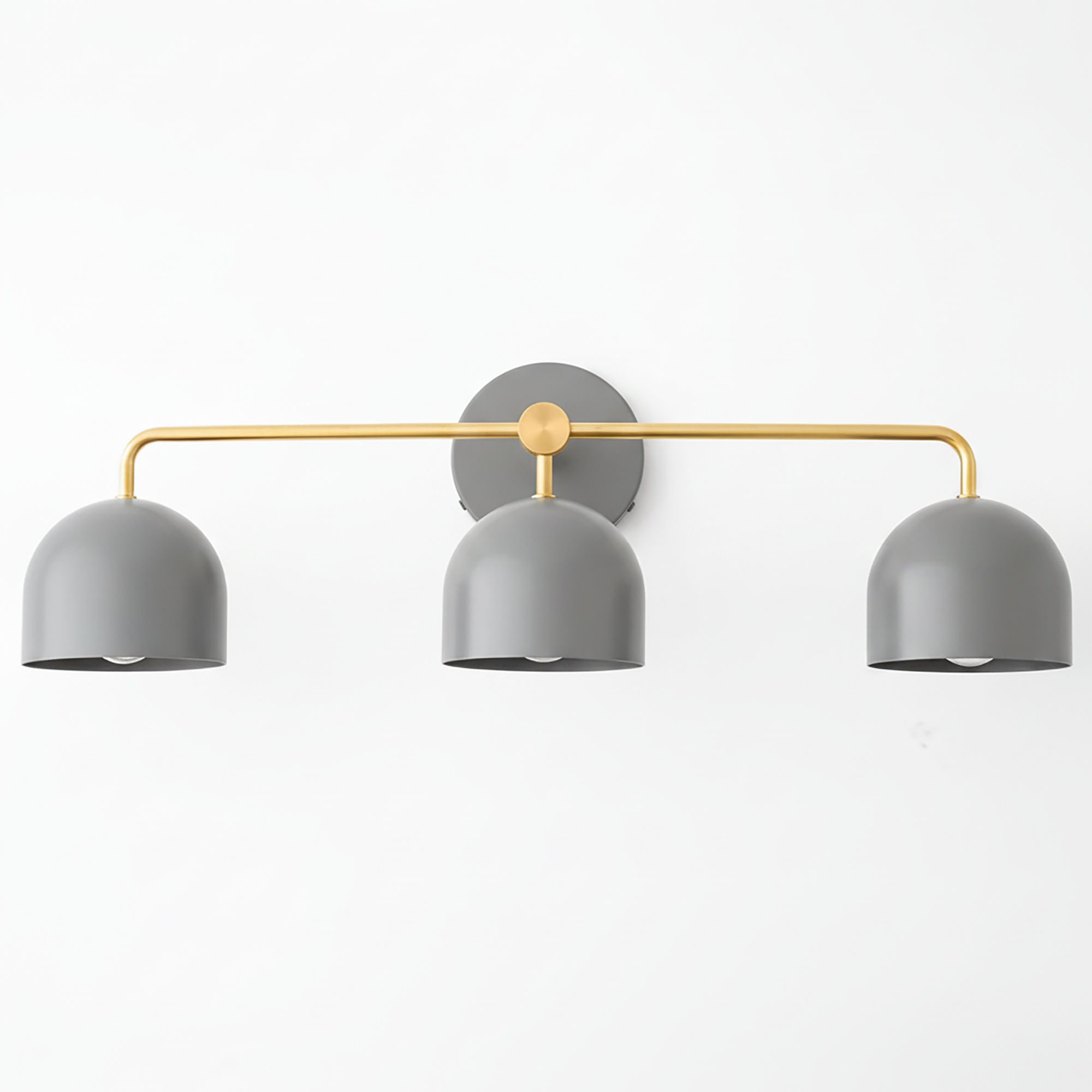 Mid-century modern vanity light with three gray dome shades and a brushed brass horizontal bar and round wall mount. - VANITY LIGHT MODEL NO. 7456