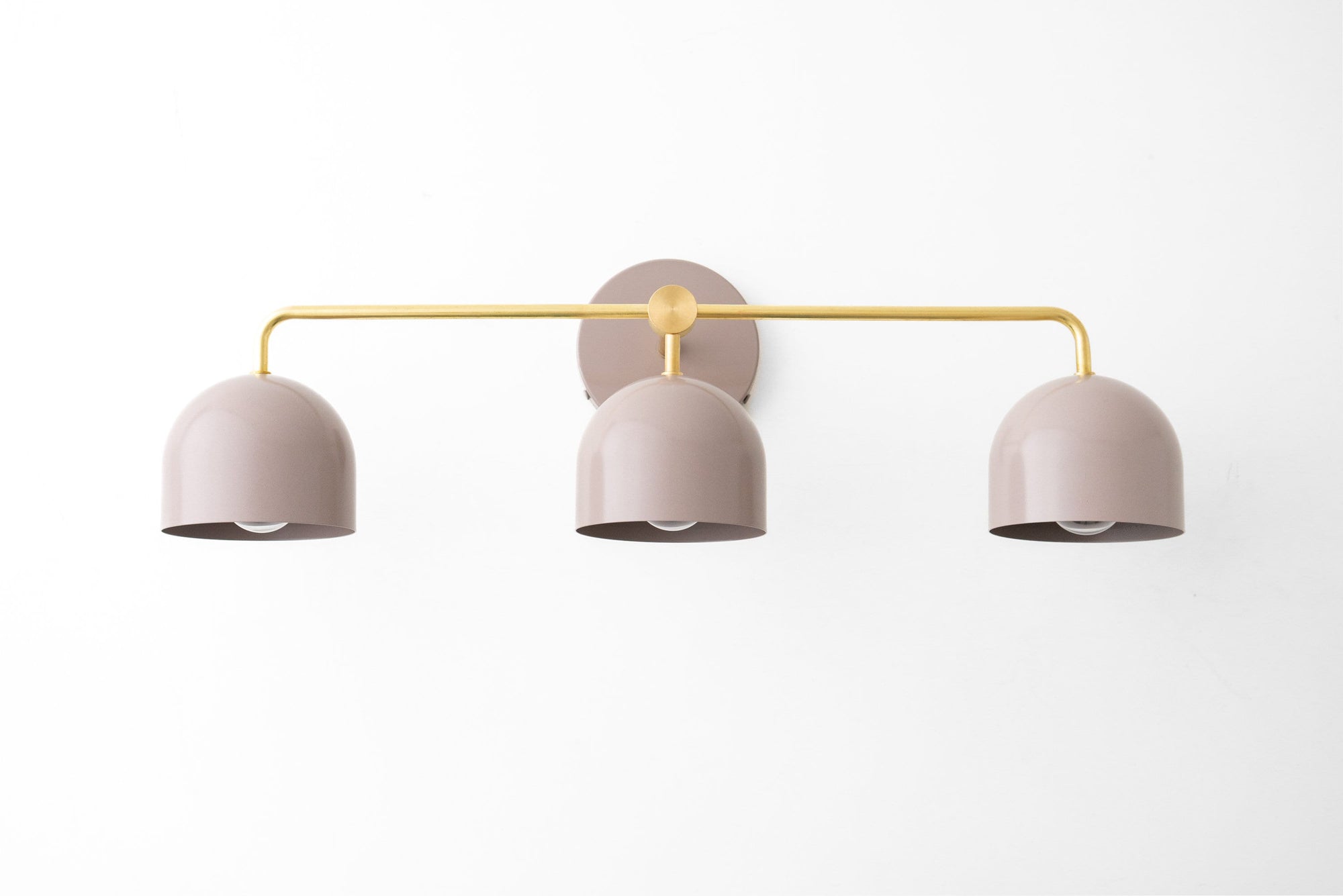 Three-bulb vanity light with matte beige dome shades and gold metal fixture in mid-century modern style. - VANITY LIGHT MODEL NO. 7456