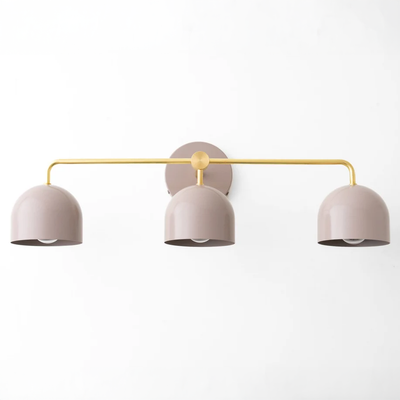 Mid-century modern vanity light with three mauve dome shades and sealed brass horizontal bar and mount. - VANITY LIGHT MODEL NO. 7456