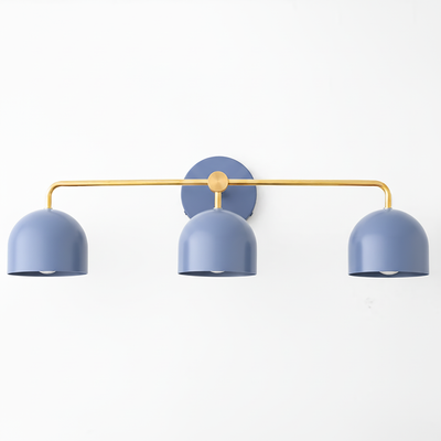 Mid-century modern vanity light with three matte blue metal dome shades and a brass-finished horizontal bar mount. - VANITY LIGHT MODEL NO. 7456