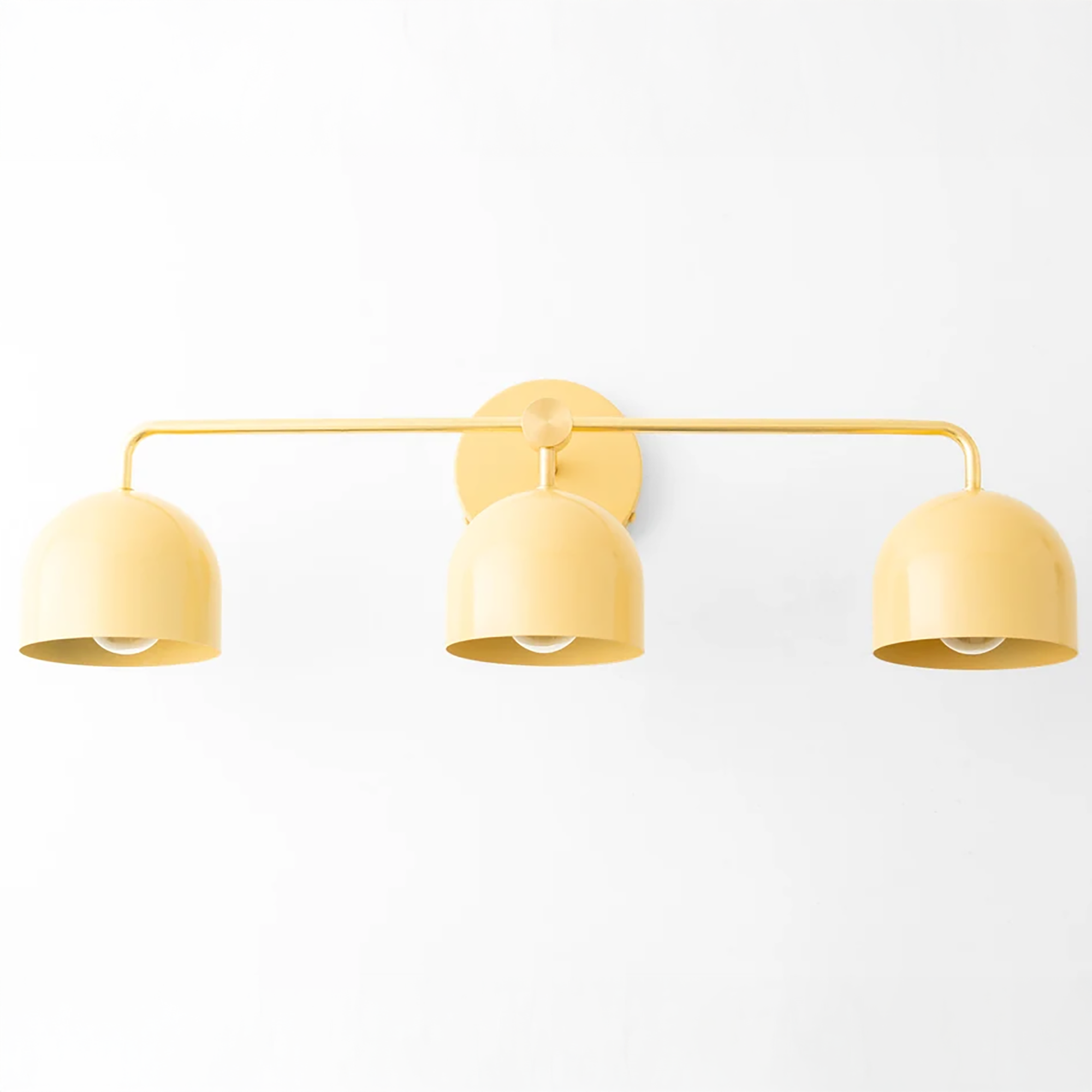 Mid-century modern yellow vanity light with three dome shades and a wall mount plate. - VANITY LIGHT MODEL NO. 7456