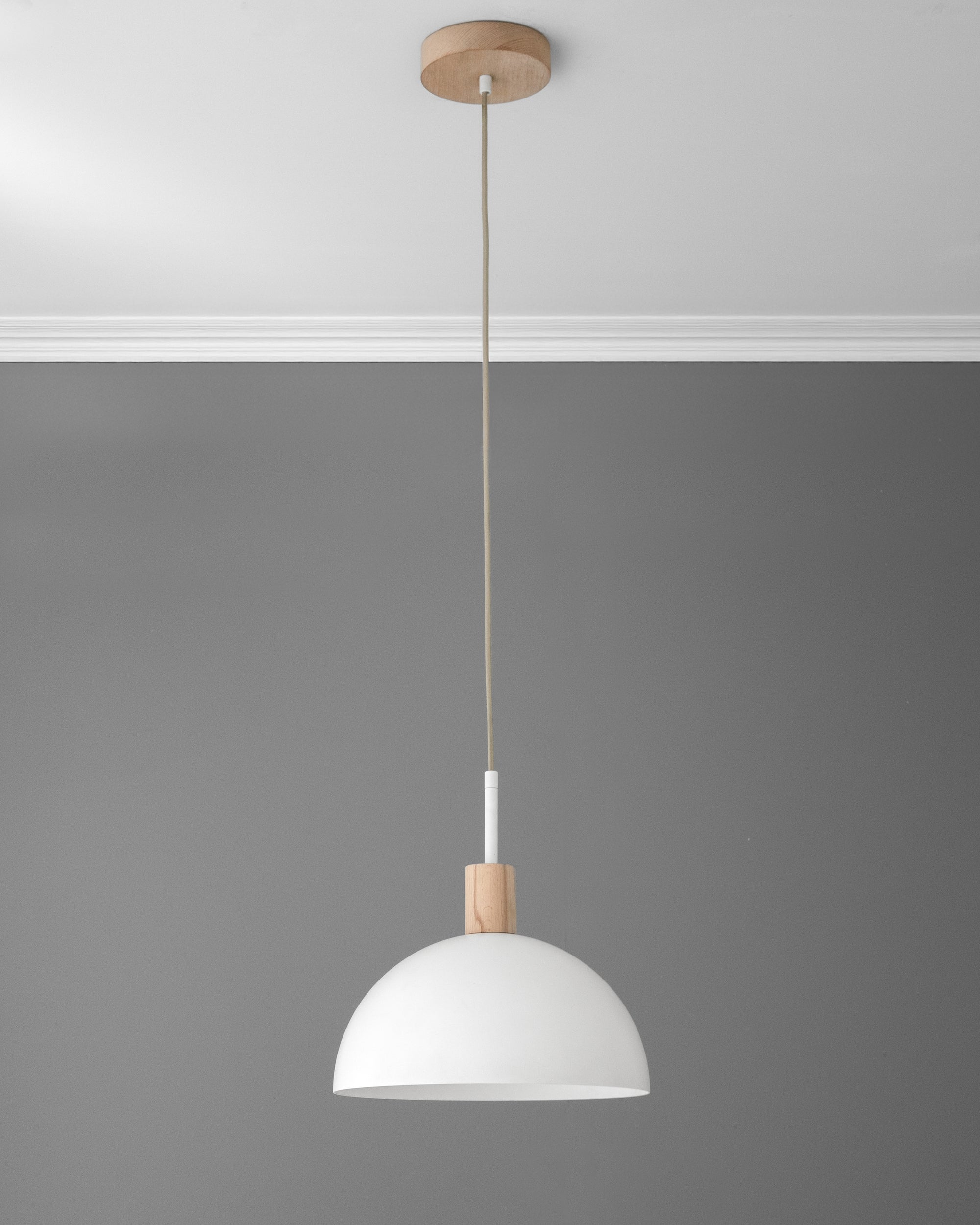 White dome pendant light with tan wood accent and matching tan cord against gray wall. - PENDANT MODEL NO. 4610