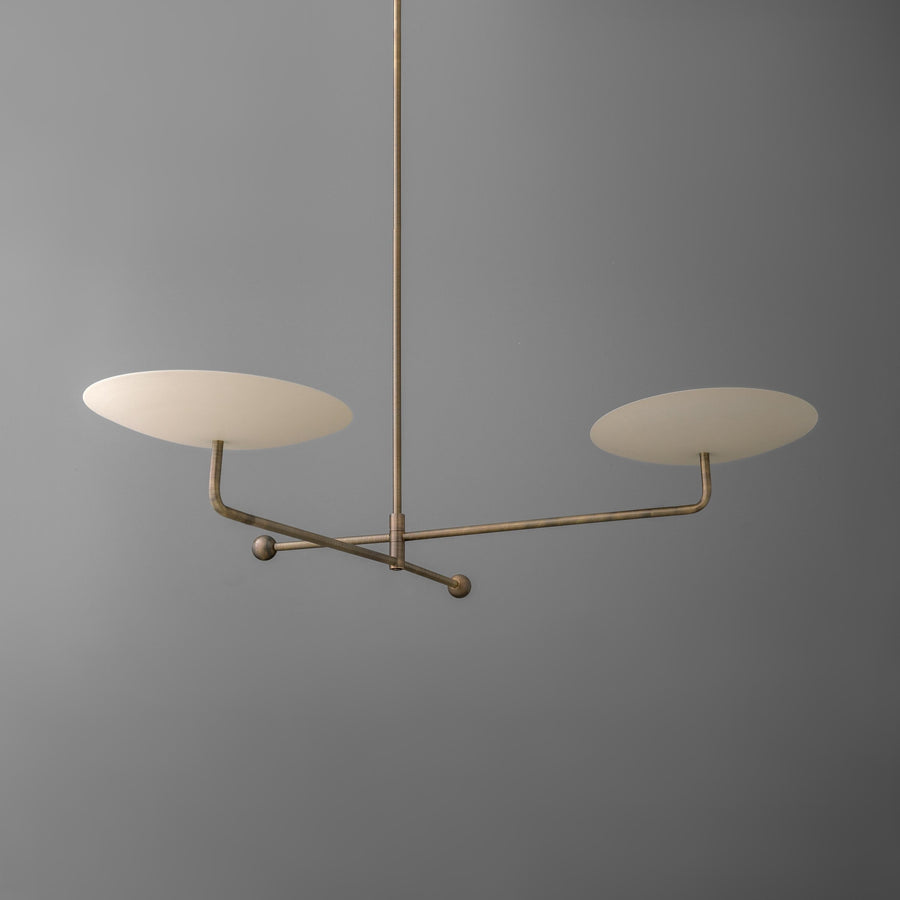 Antique brass chandelier with two cream disc-shaped shades on horizontal arms against gray background. - CHANDELIER MODEL NO. 0680